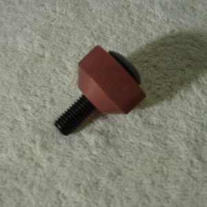 A black hold-down bolt with a red Knurled Knob