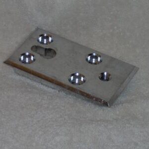 A Large aluminum block for the cot latch, floor plate